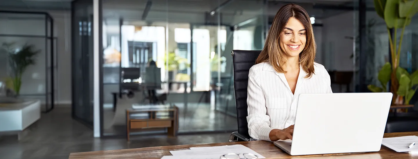 HCL BigFix Workspace+ dashboard illustration showcasing unified workspace management, device visibility, and digital employee experience across laptops and mobile endpoints